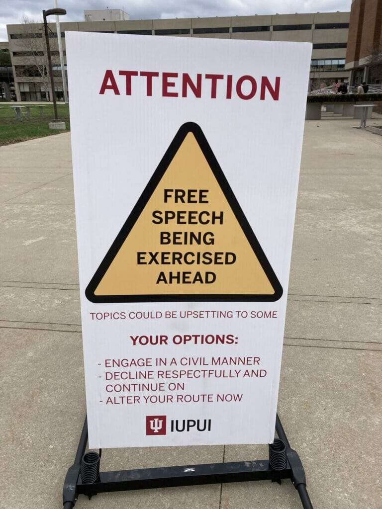 caution free speech sign IUPUI