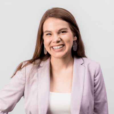 A woman smiles at the camera.