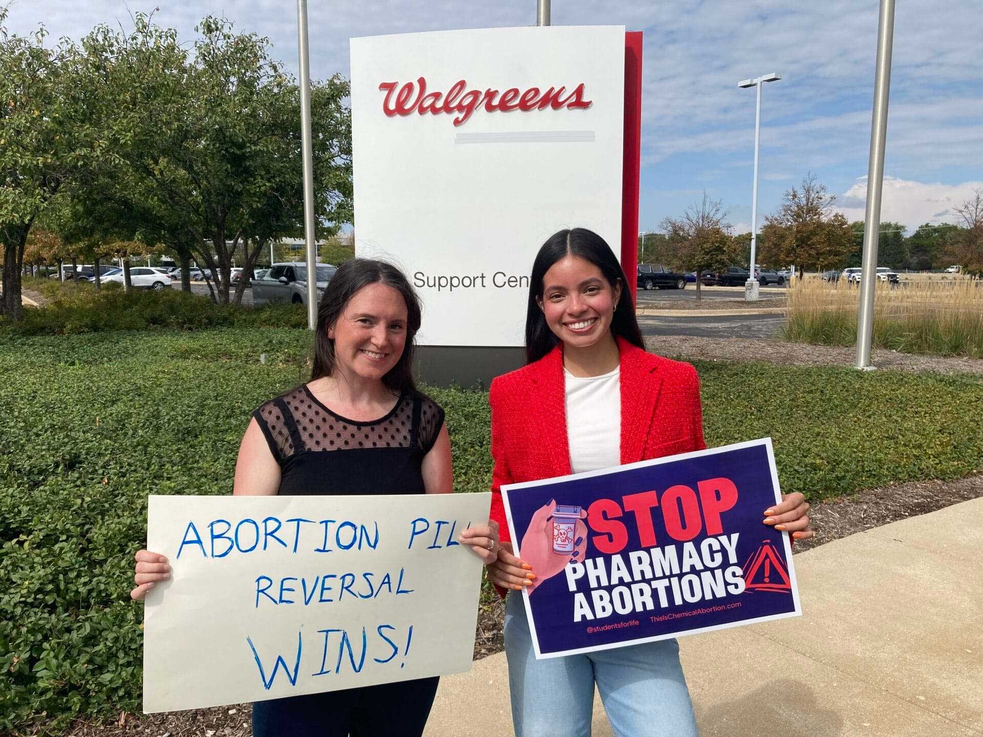 Protesters of chemical abortion pill in front of Walgreens support center.