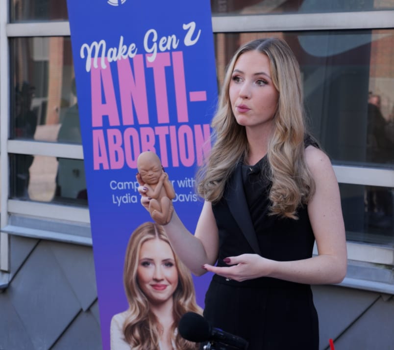 A woman gives a speech.