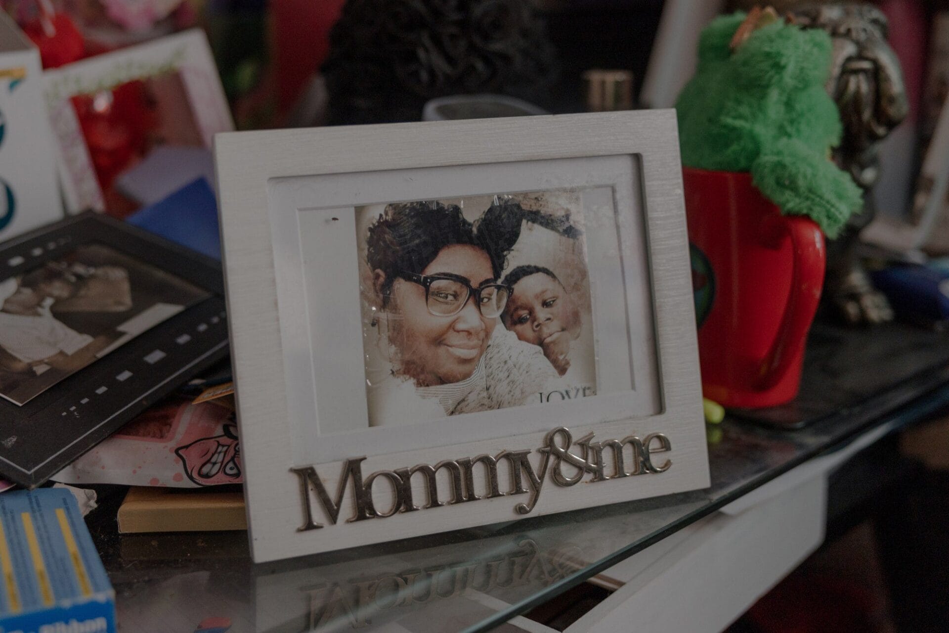 A photo of two people in a frame with the words "Mommy&me" at the bottom